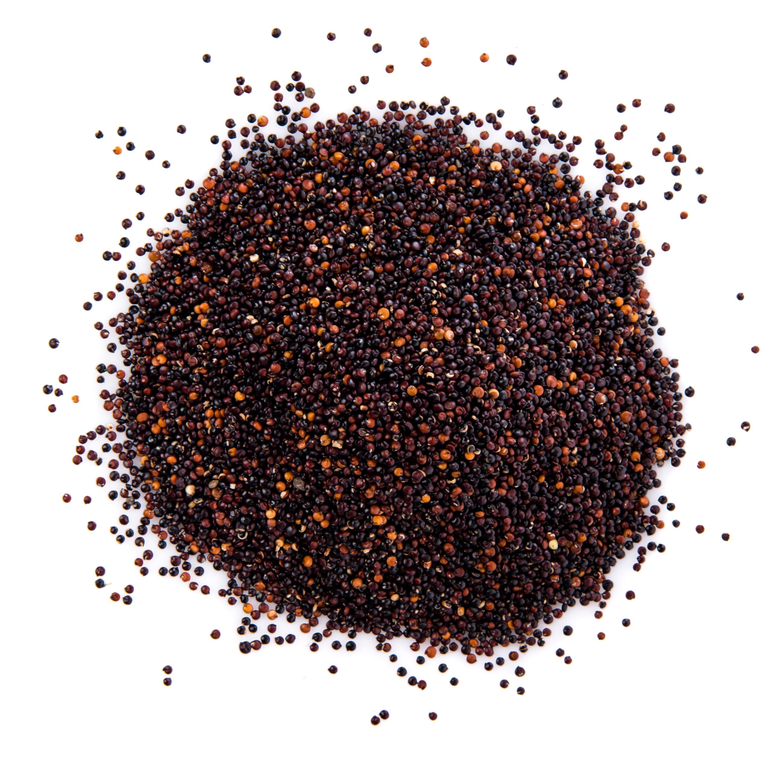 Sesame oil and raw black sesame seeds on dark background